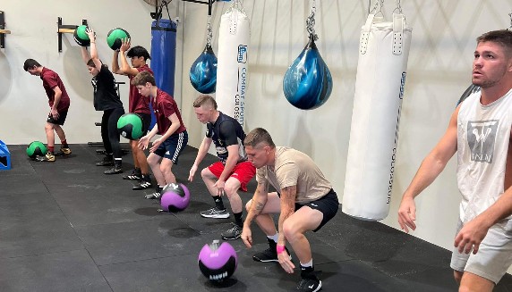 Boxing athletes using new gym equipment