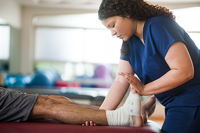Physio looking at an injured foot
