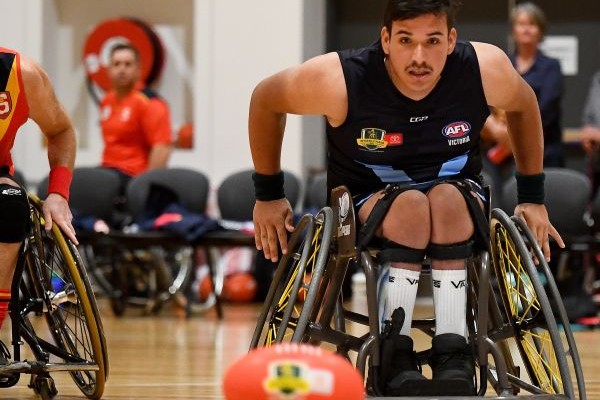 Male playing wheelchair AFL