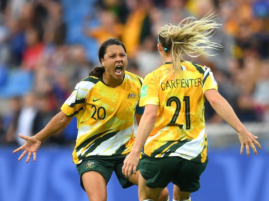 Sam Kerr (left) and Ellie Carpenter (right) celebrate their sides victory at the 2019 FIFA World Cup in France//Getty Images