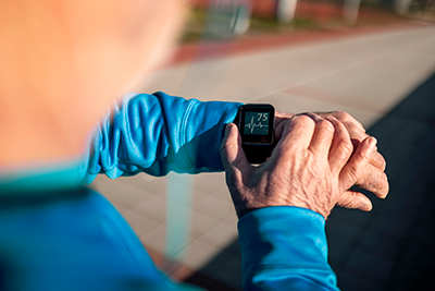 Senior Man using Smart Watch