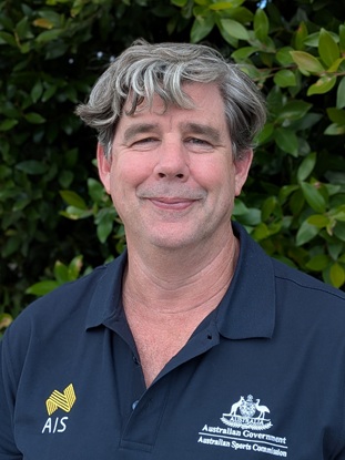Headshot of Andrew Lyttle wearing AIS polo