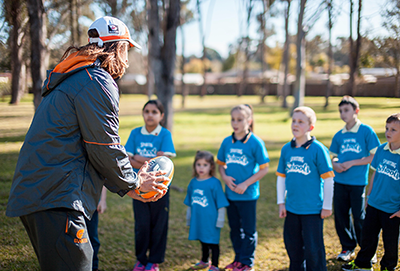 Dylan Addison, Greater Western Sydney Giants AFL player showing the school students and kids some AFL skill