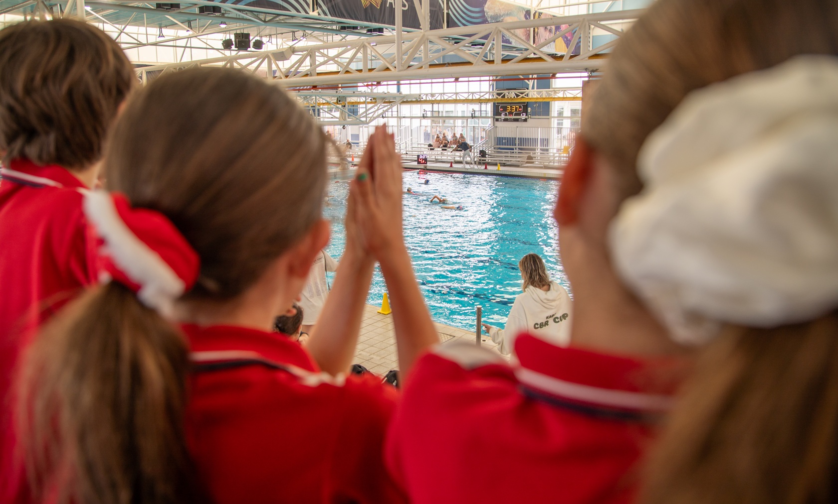 School children watching water polo on AIS Tour