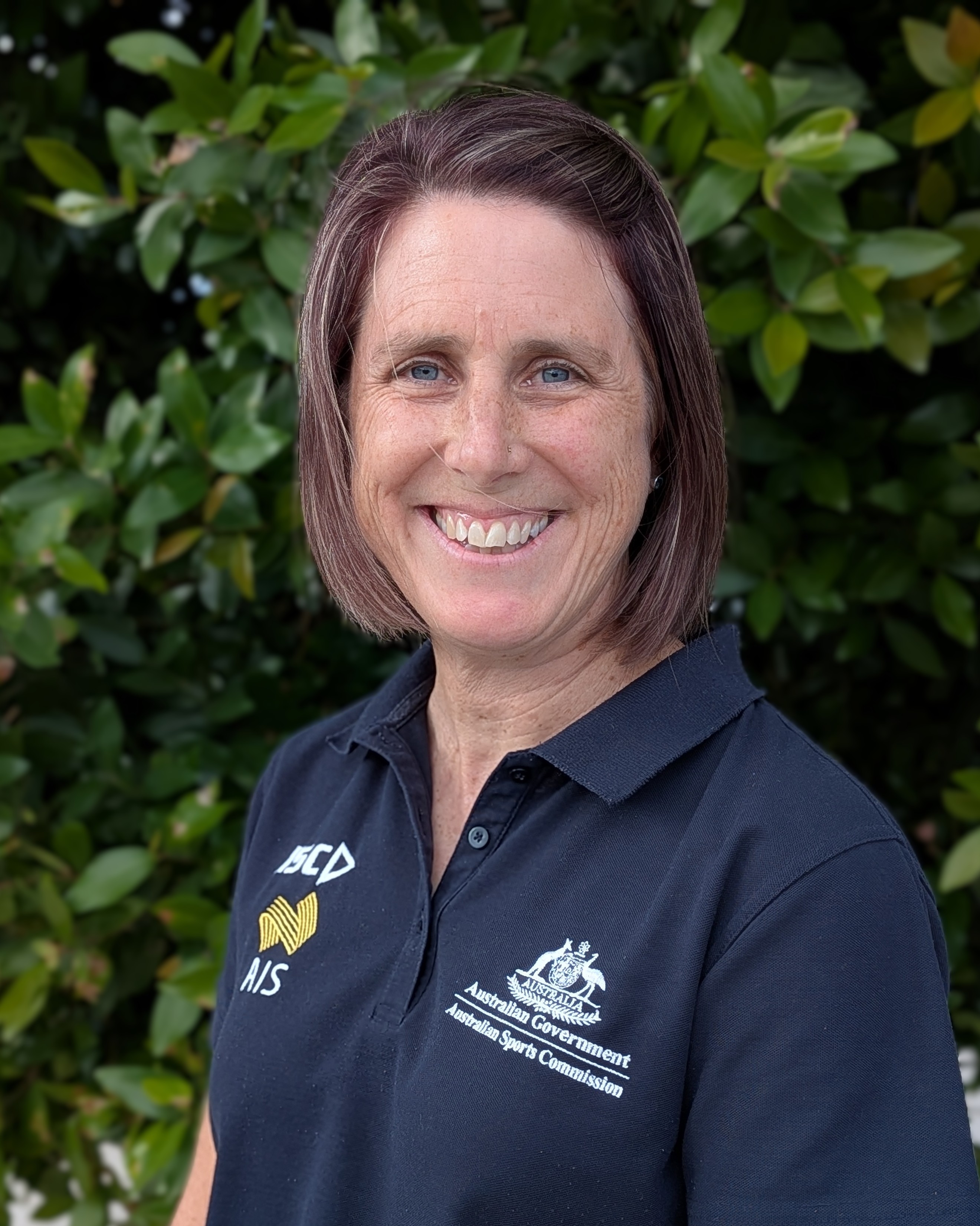 Headshot of Kristine Dun wearing AIS polo