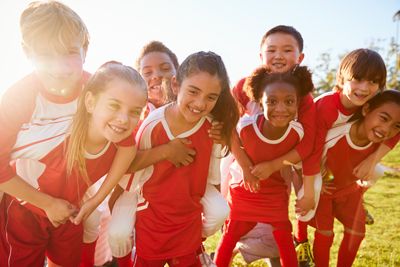 Young football players smiling faces
