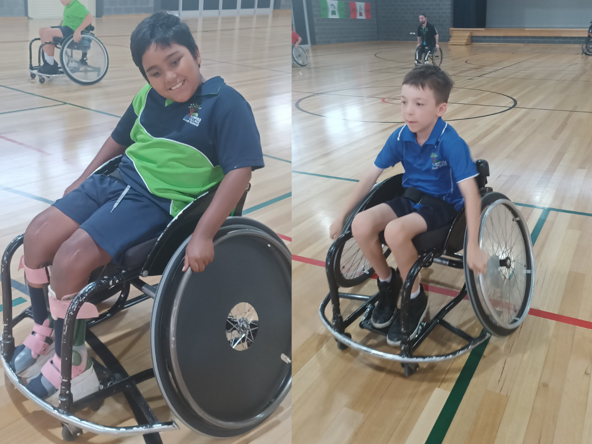 Two kids on a wheelchair playing sport at school