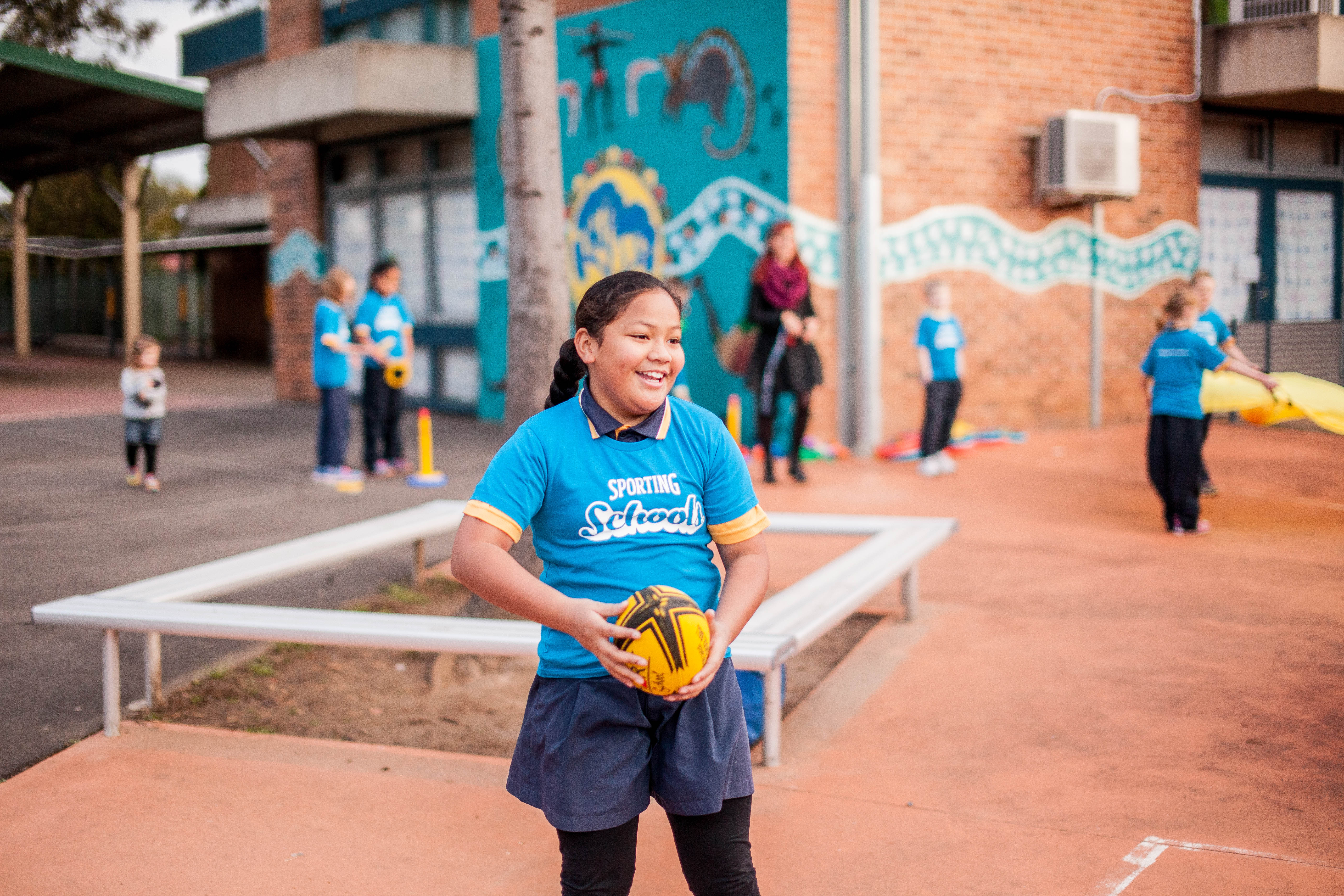 Young kid playing sport and smiling