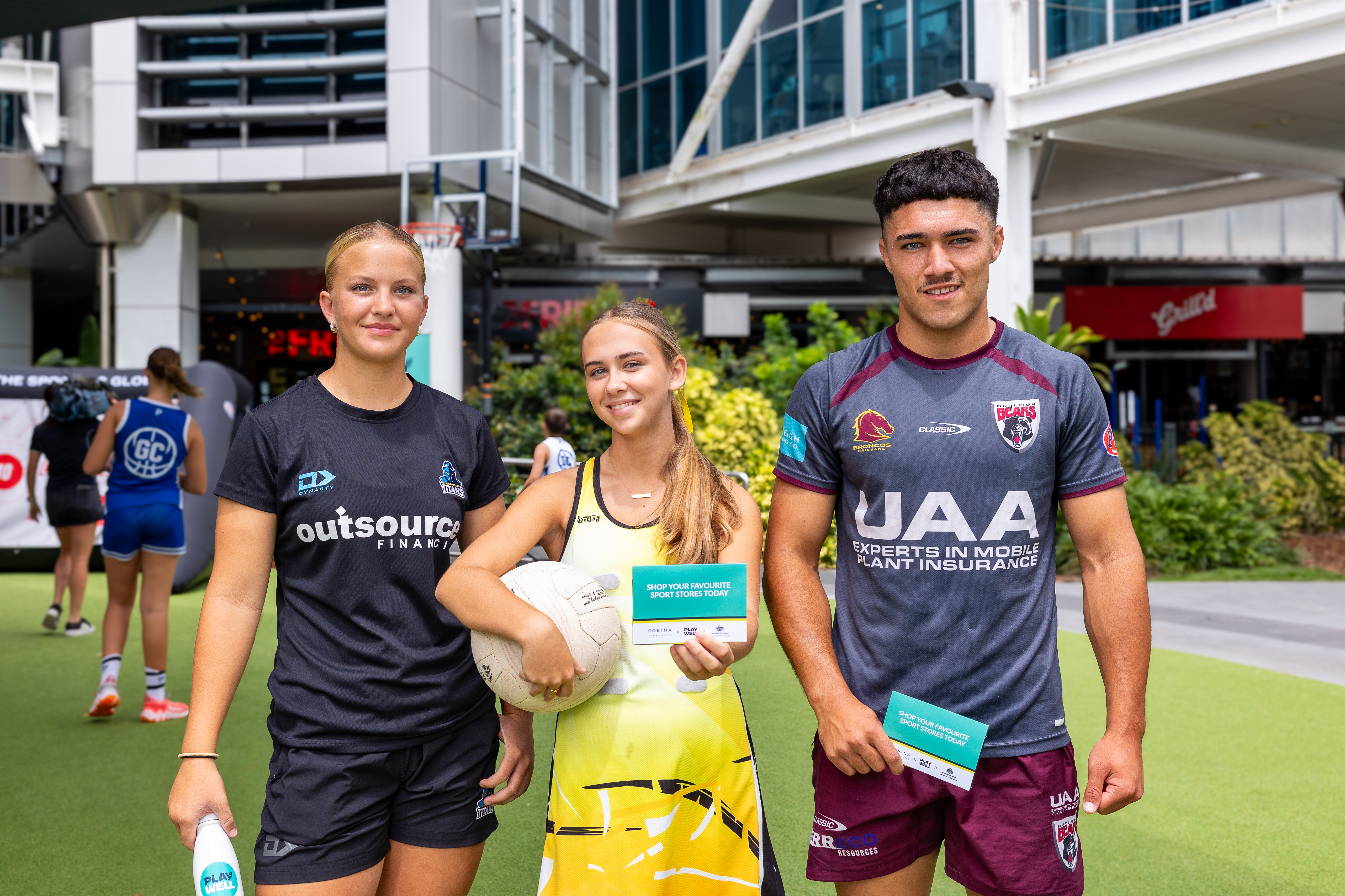 Athletes with their Play Well gift cards