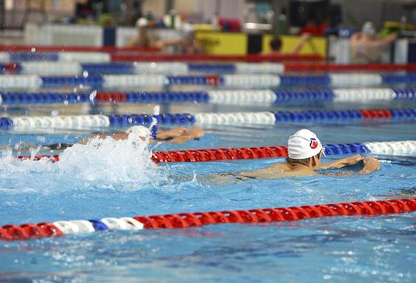AIS swimmers training with kick boards