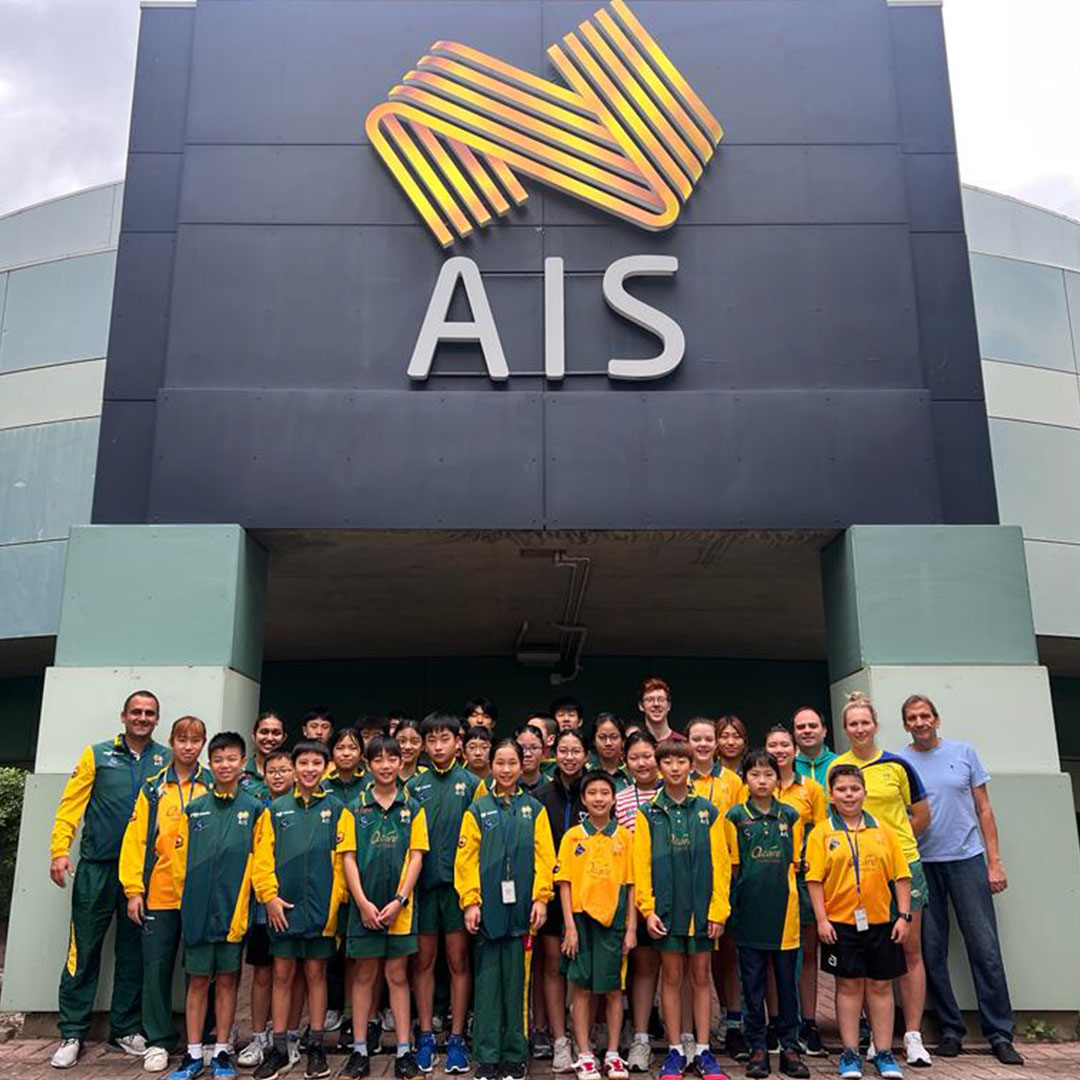 people stand outside in front of a building