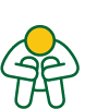 A person sitting on the ground with their head lowered