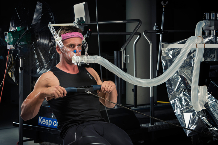 C4S-evidence-performance support-person performing a VOMax on a rowing machinge
