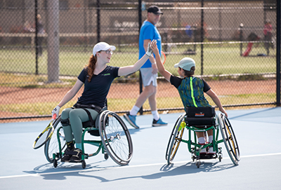 C4S-image-Wheelchair Tennis player high fiving