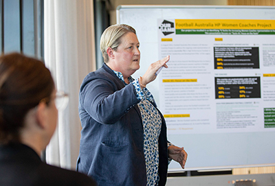 A female presenting to a group