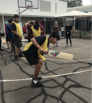 Sporting Schools - Cricket batter in school courtyard