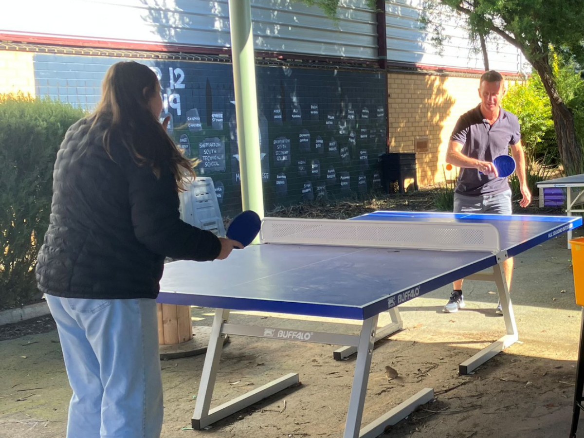 A table tennis table at a school in Shepparton Victoria and a photo of their teacher Stuart Shaw