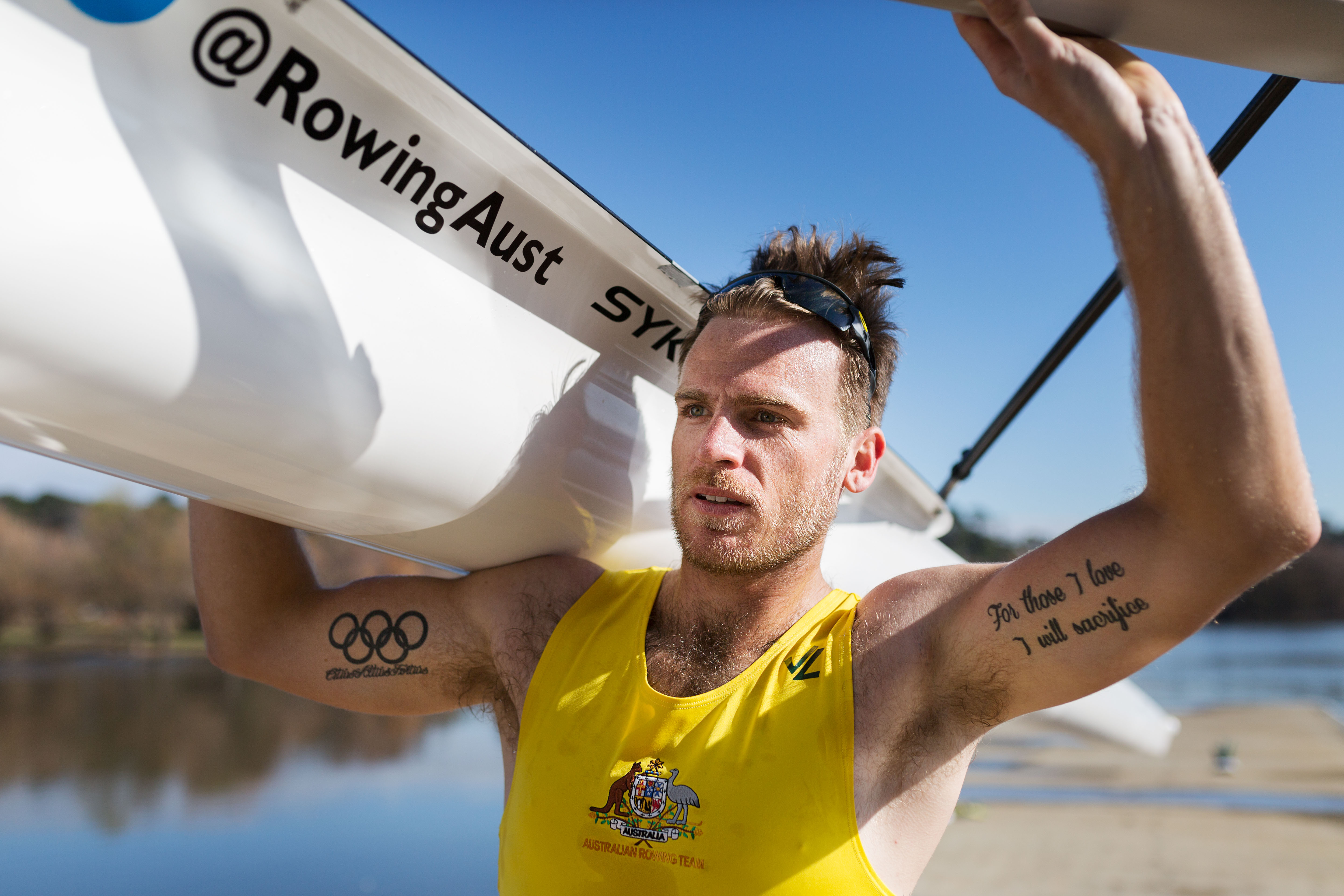Rower carrying a row boat