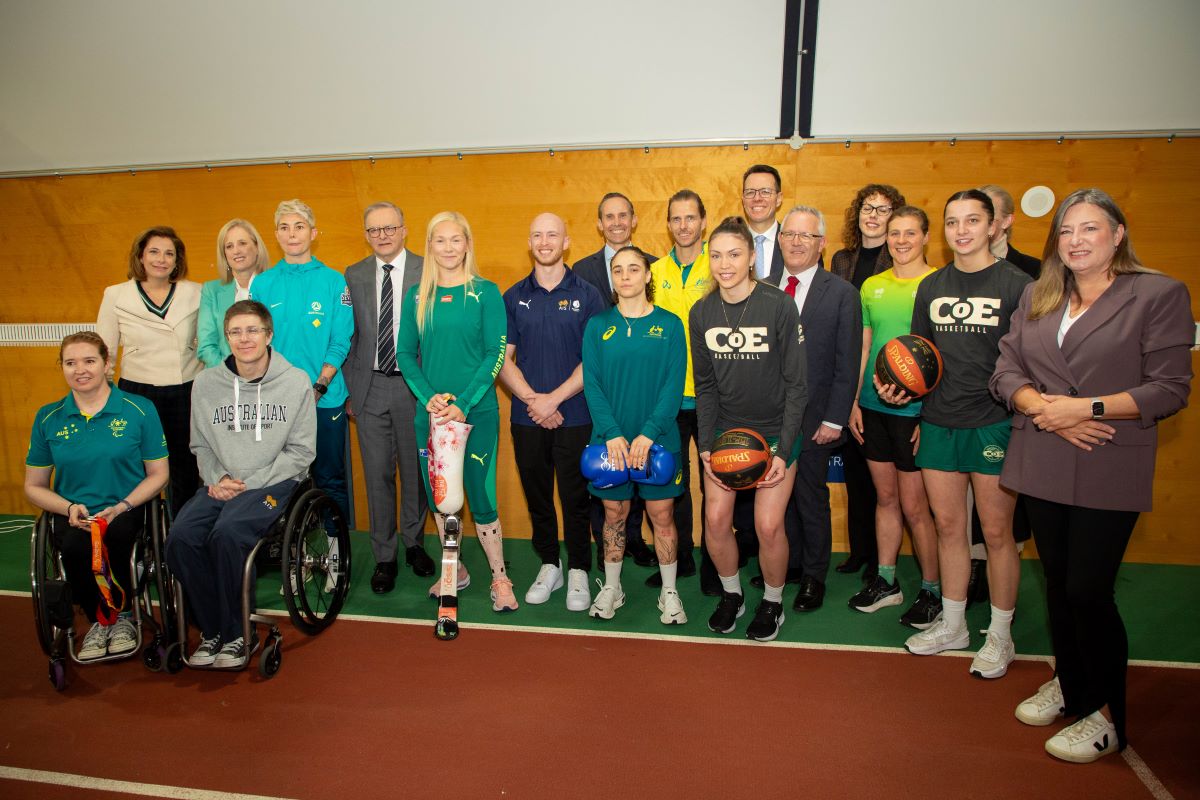Group photo featuring members of the Australian Government with athletes at the AIS.
