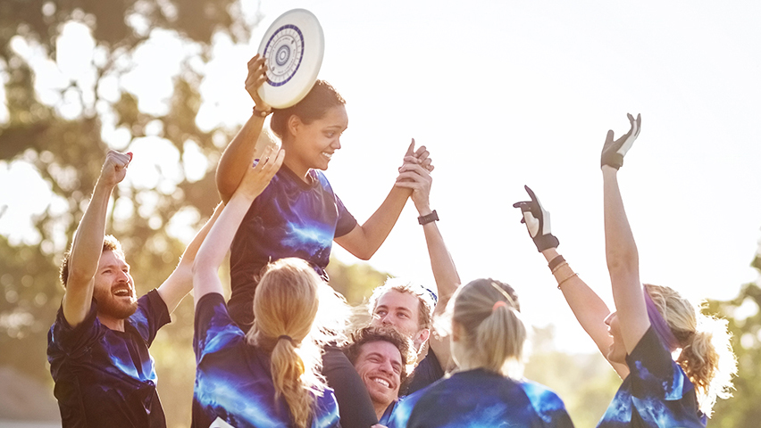 A Flying Disc team celebrating together
