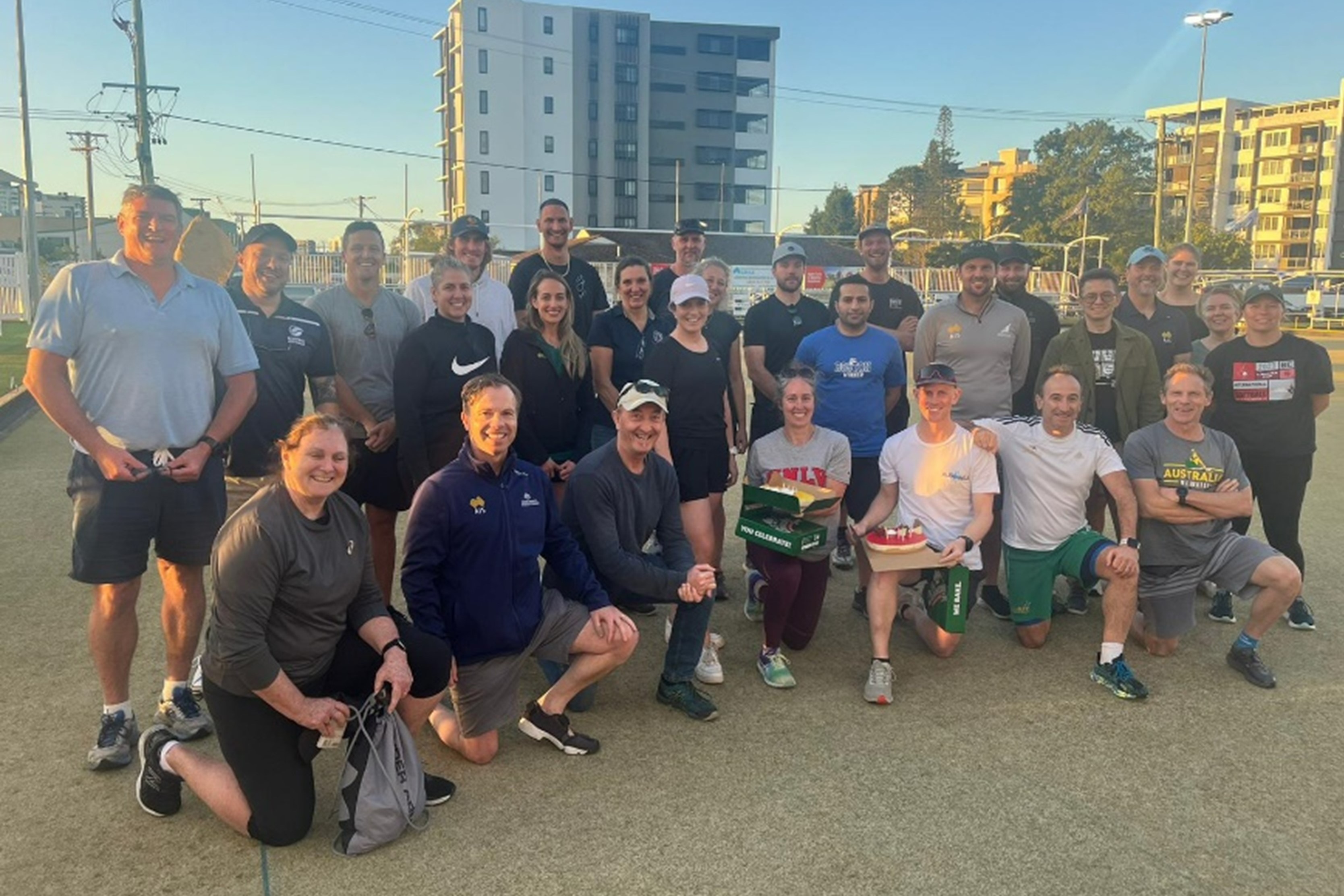 Group photo of Elevate Coaches on Bowls green.