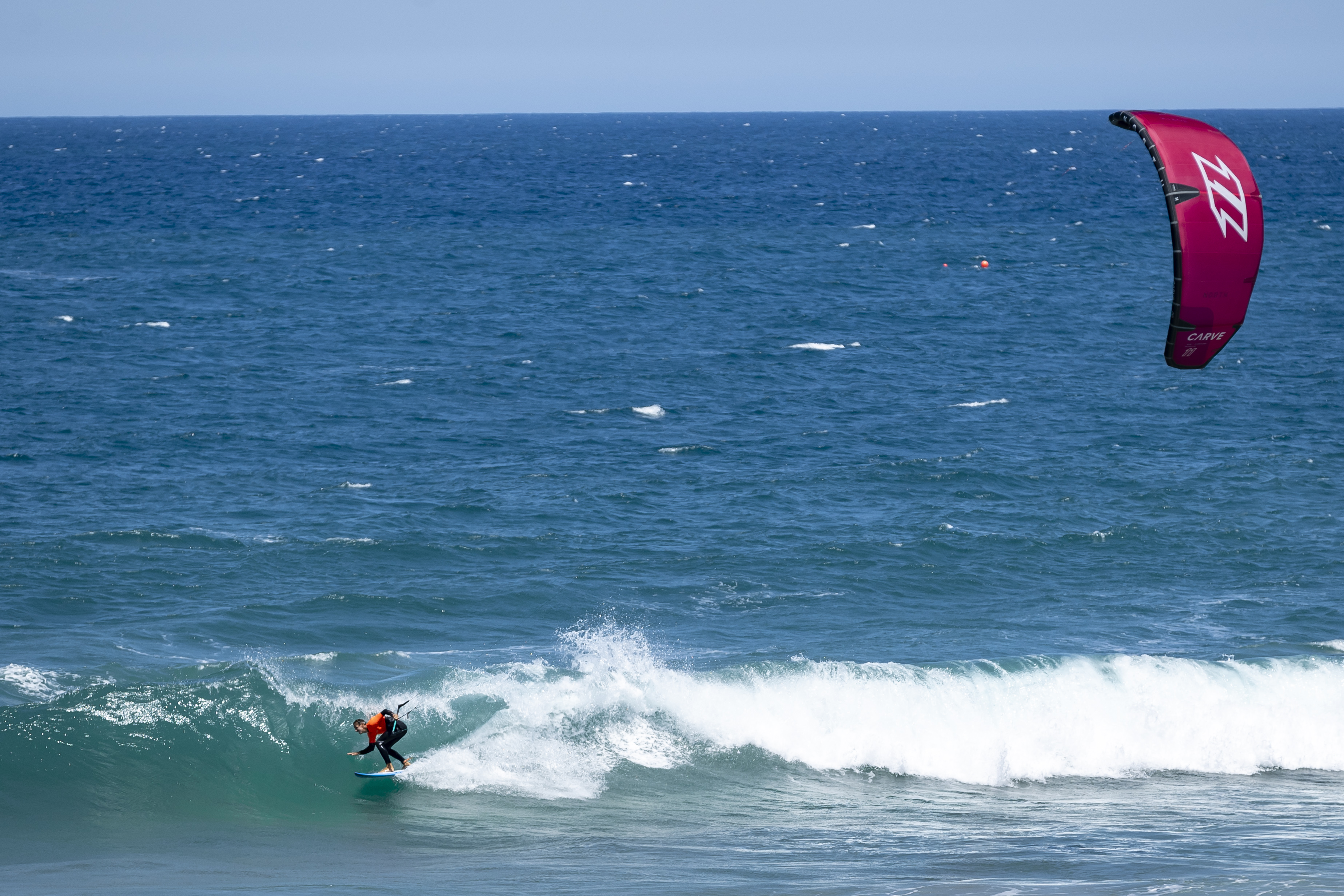 Image of kiteboarder over the water