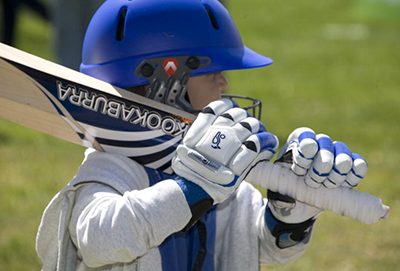 C4S-evidence-factors influencing sport participation-child with a cricket bat