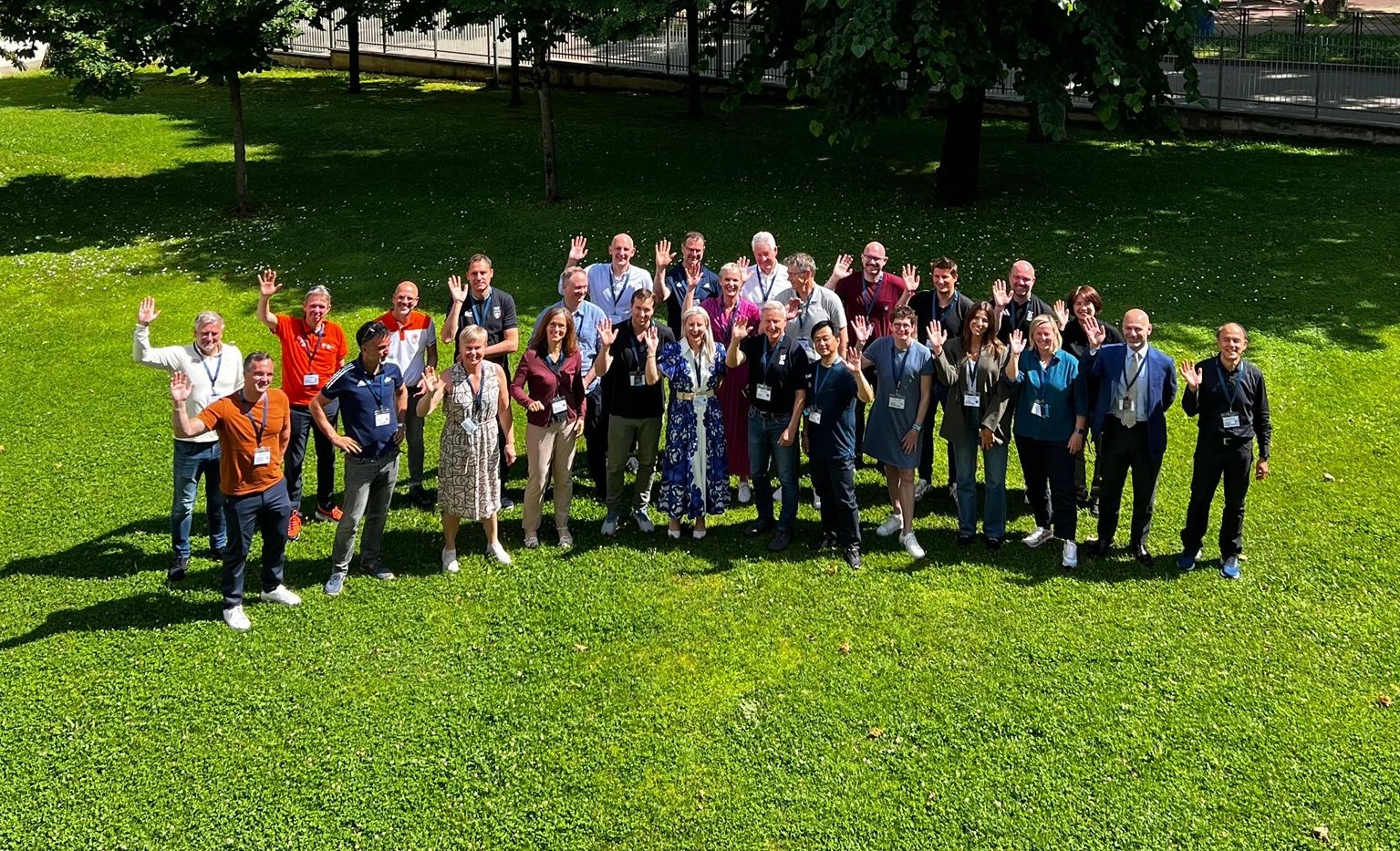 A group of people standing at the AIS European Training Centre