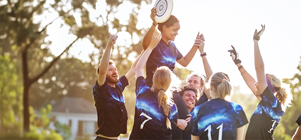 Young frisbee players celebrate their winning of the match