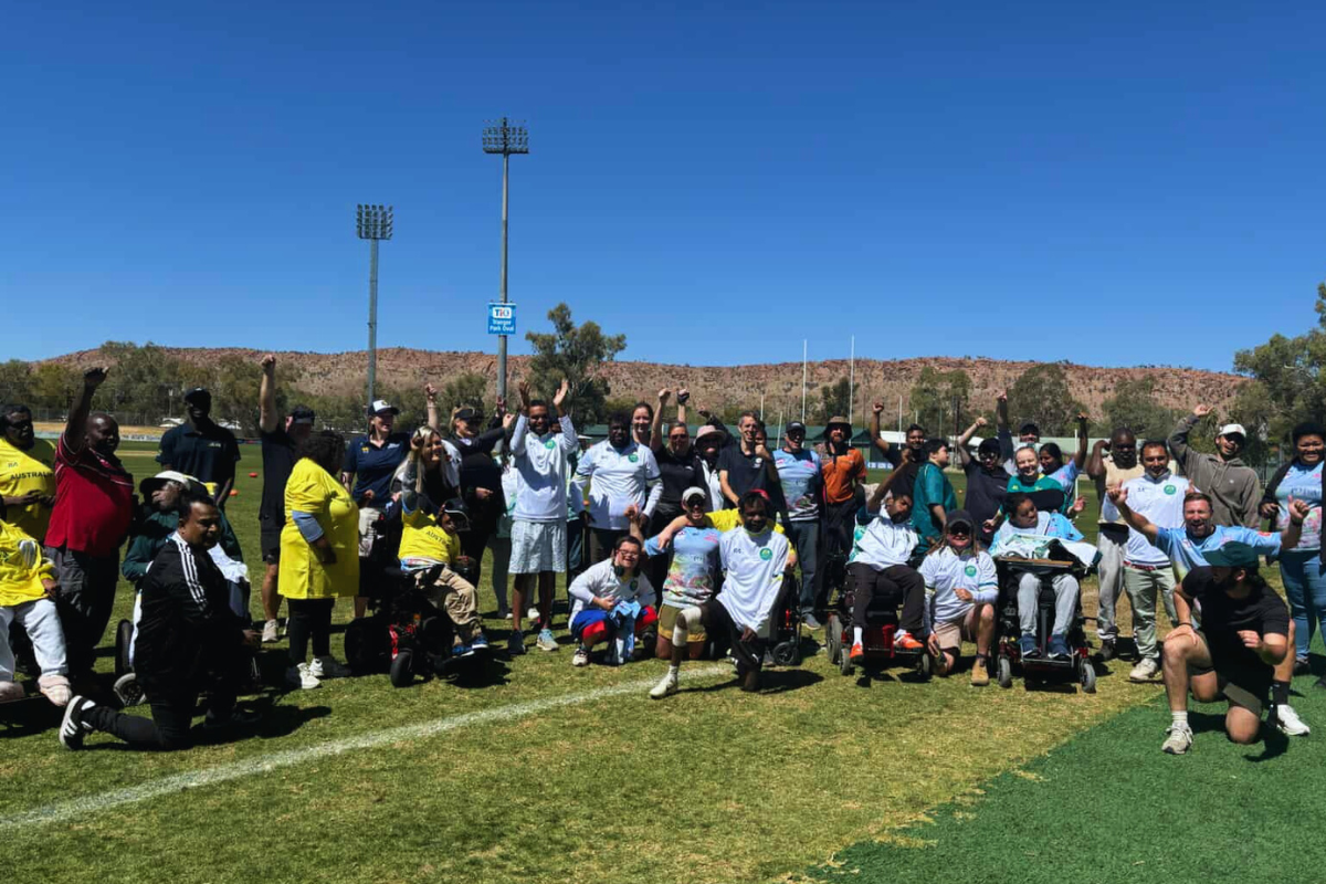 Group of people cheering in Alice Springs for Mini Paralympics event