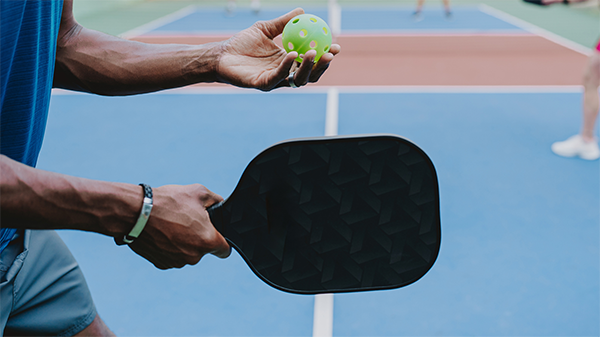 Group of people playing pickleball