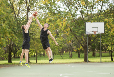 Men playing basketball