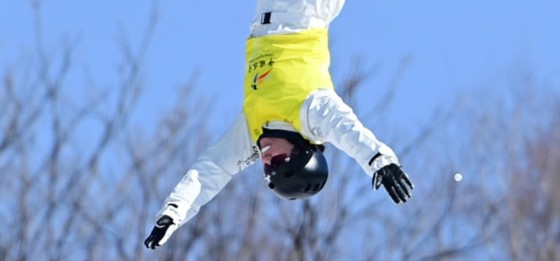 Female skier mid air