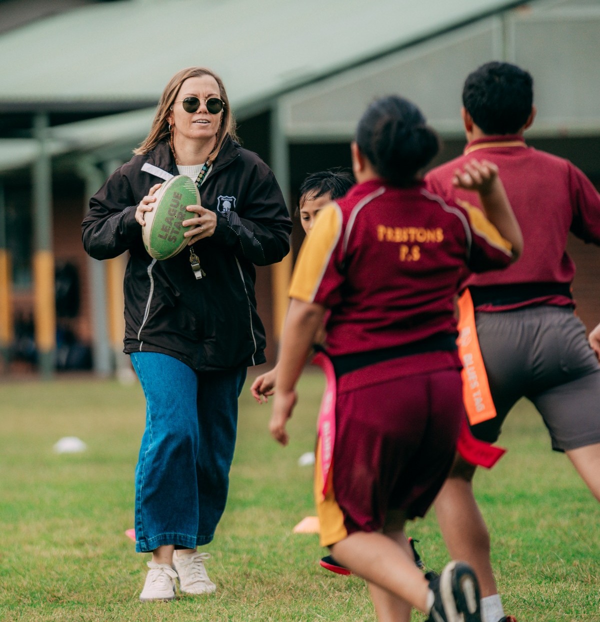 Sporting Schools - Boys and girl playing touch football