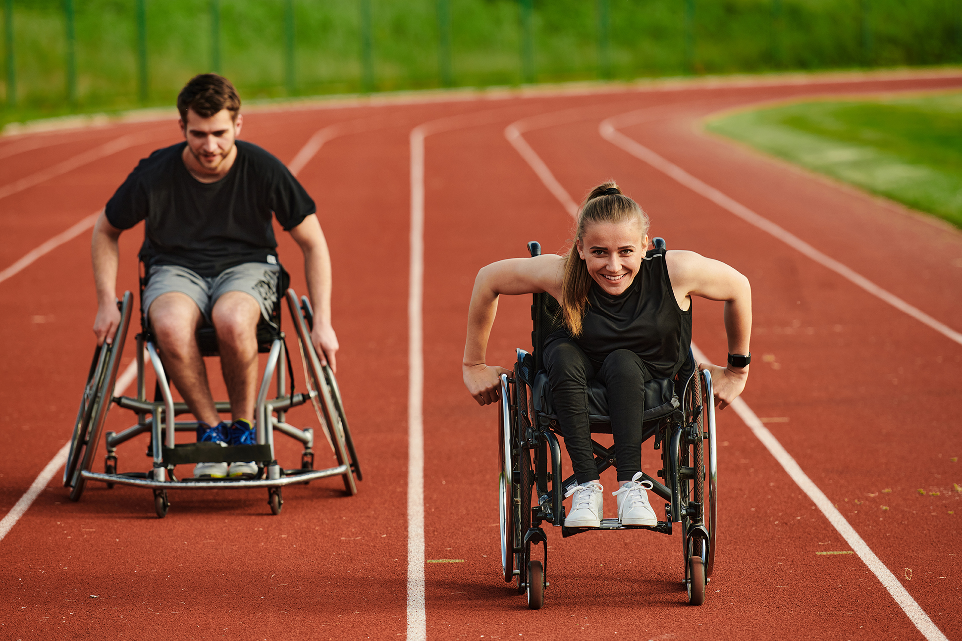Image of two wheelchair racers on a track