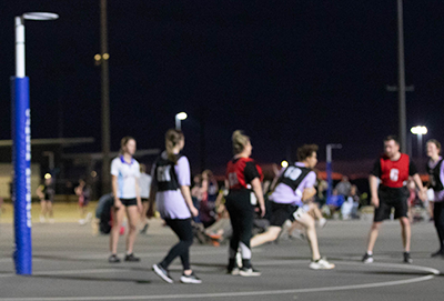 C4S-image-Blurred image of individuals engaged in a game of netball