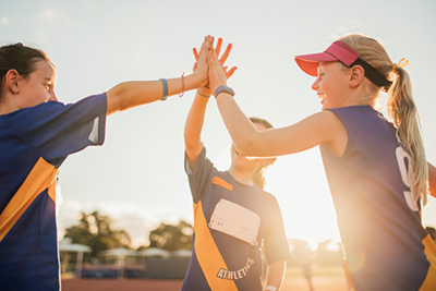 Girls giving a high five to each other