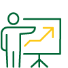 Person standing and presenting information, beside a board