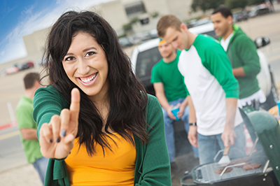 A female football fan holding up #1 finger